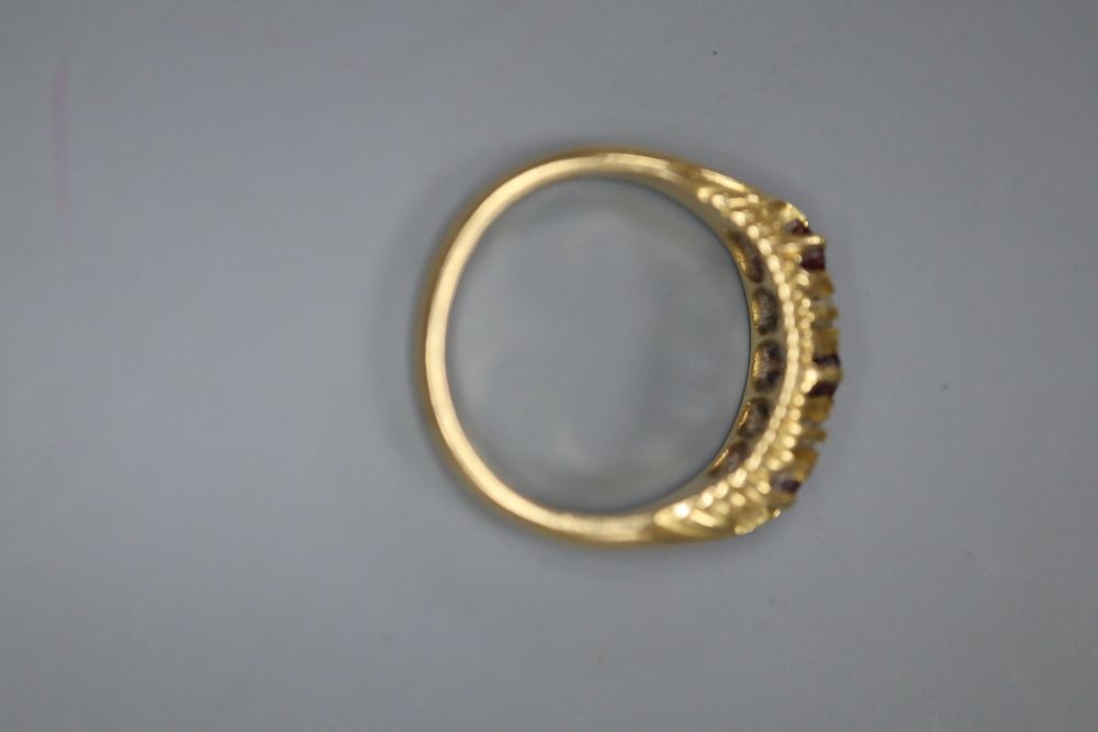 A late Victorian 18ct gold, ruby and diamond five stone ring, size I, gross 3.6 grams.